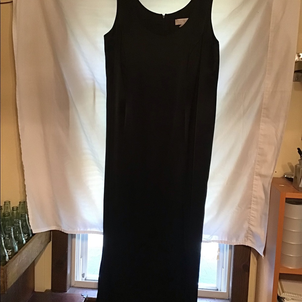 Niteline Della Roufogali long satin evening dress. High slight on the front.